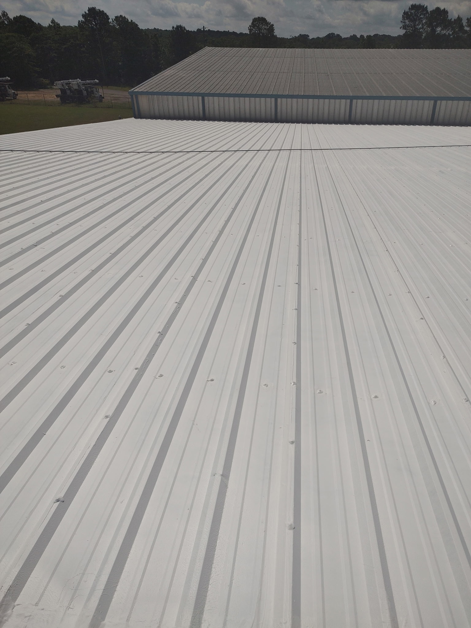 Metal roof coating installation
